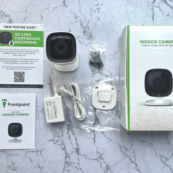 Frontpoint indoor camera, mounting hardware, power plug, box, and installation instructions