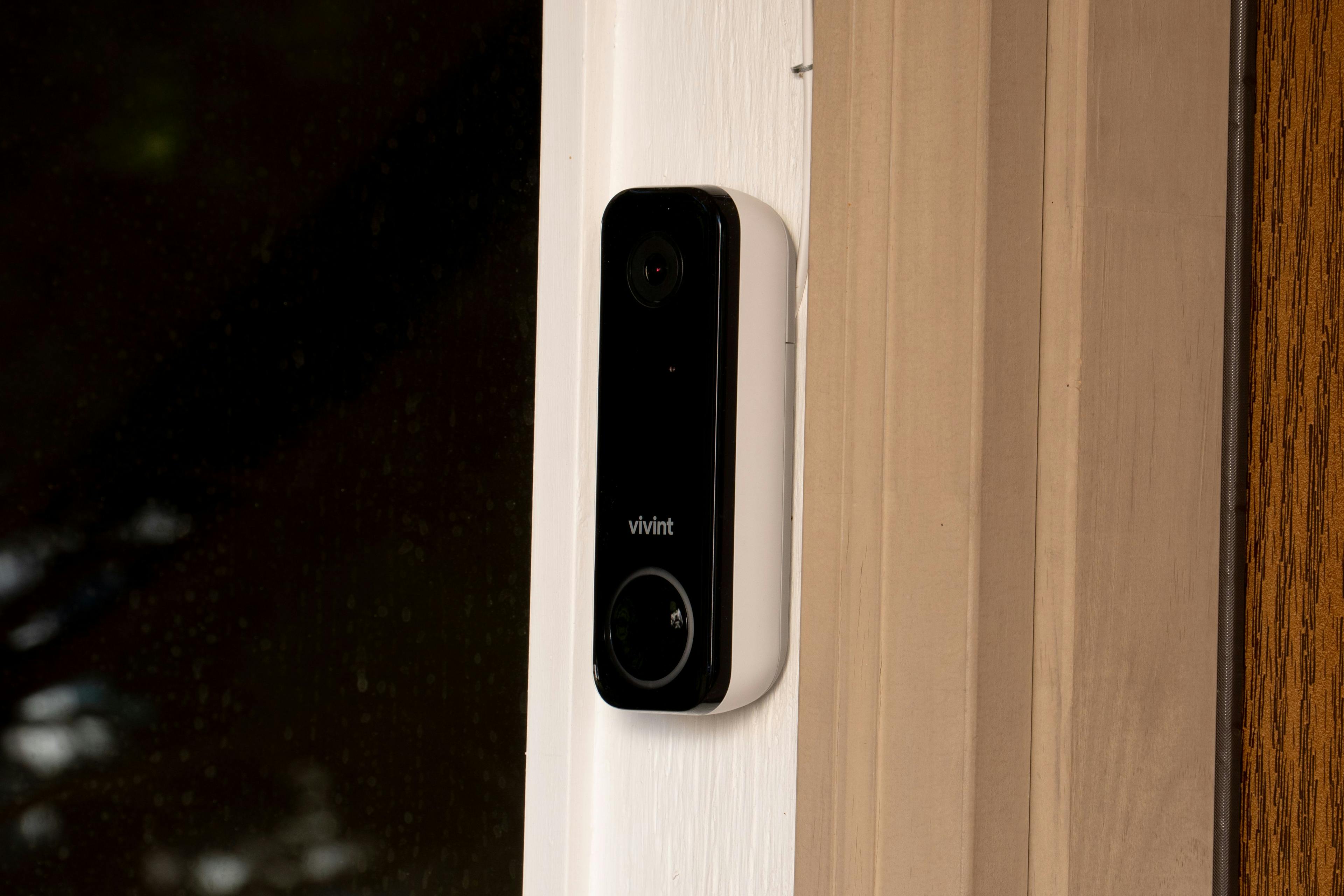 Vivint video doorbell attached to outside doorframe