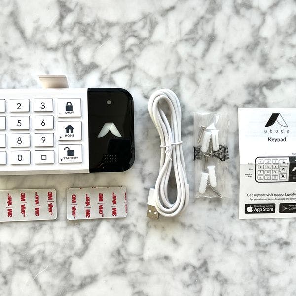 Abode keypad, peel-and-stick adhesives, power cord, and installation guide