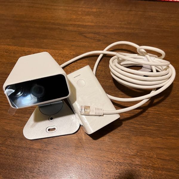 Unplugged Xfinity home security indoor camera and power plug